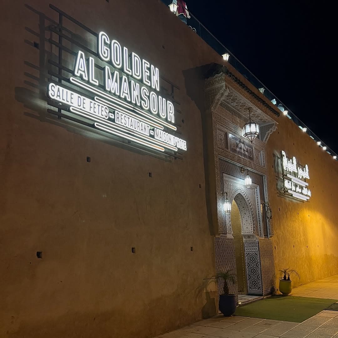 Golden Al Mansour logo